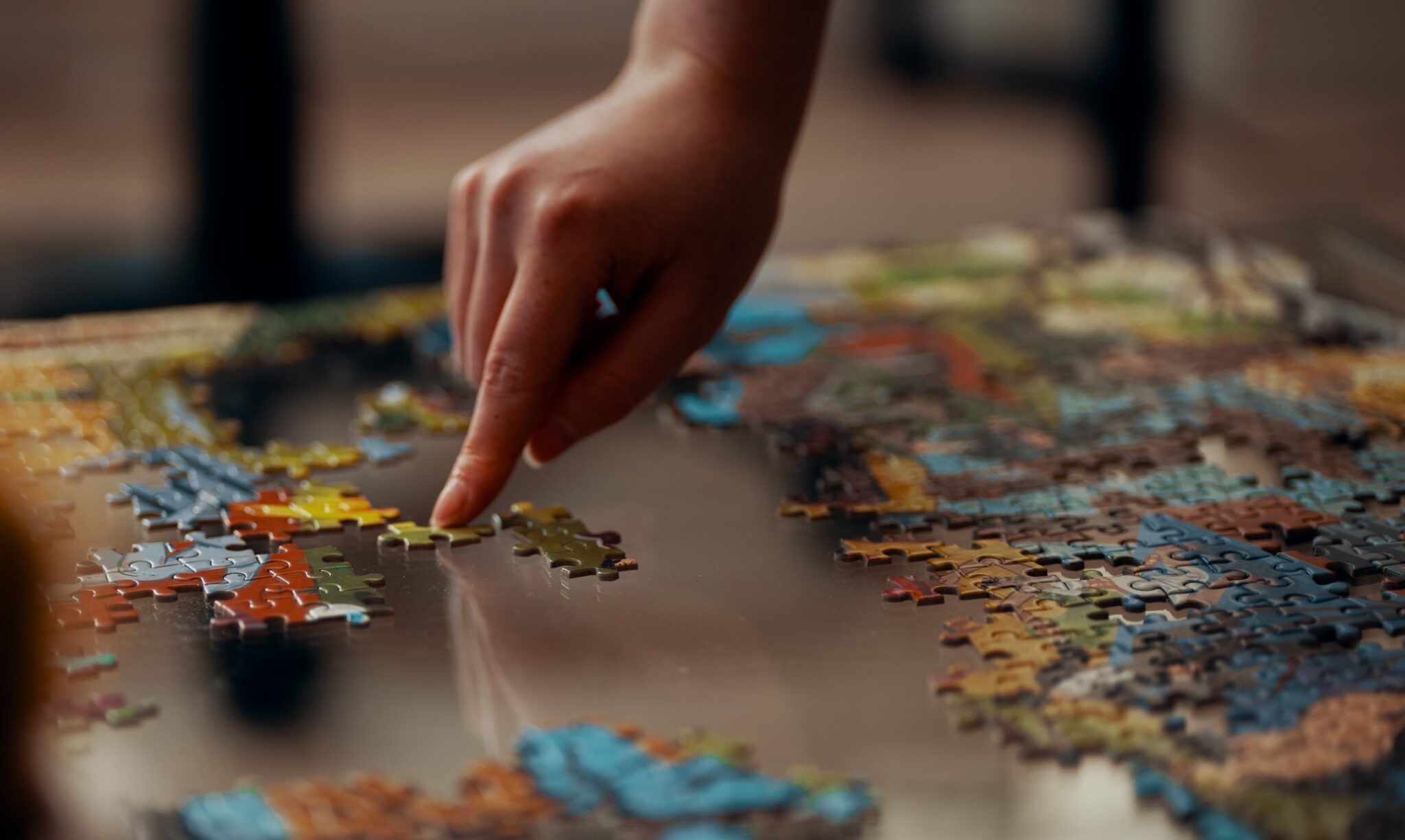 Person working on a jigsaw puzzle