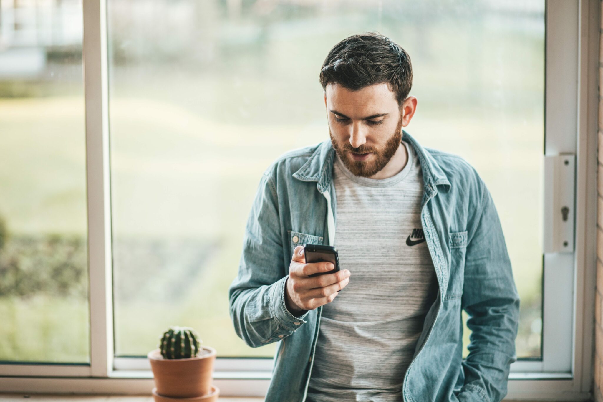 Man in house on phone