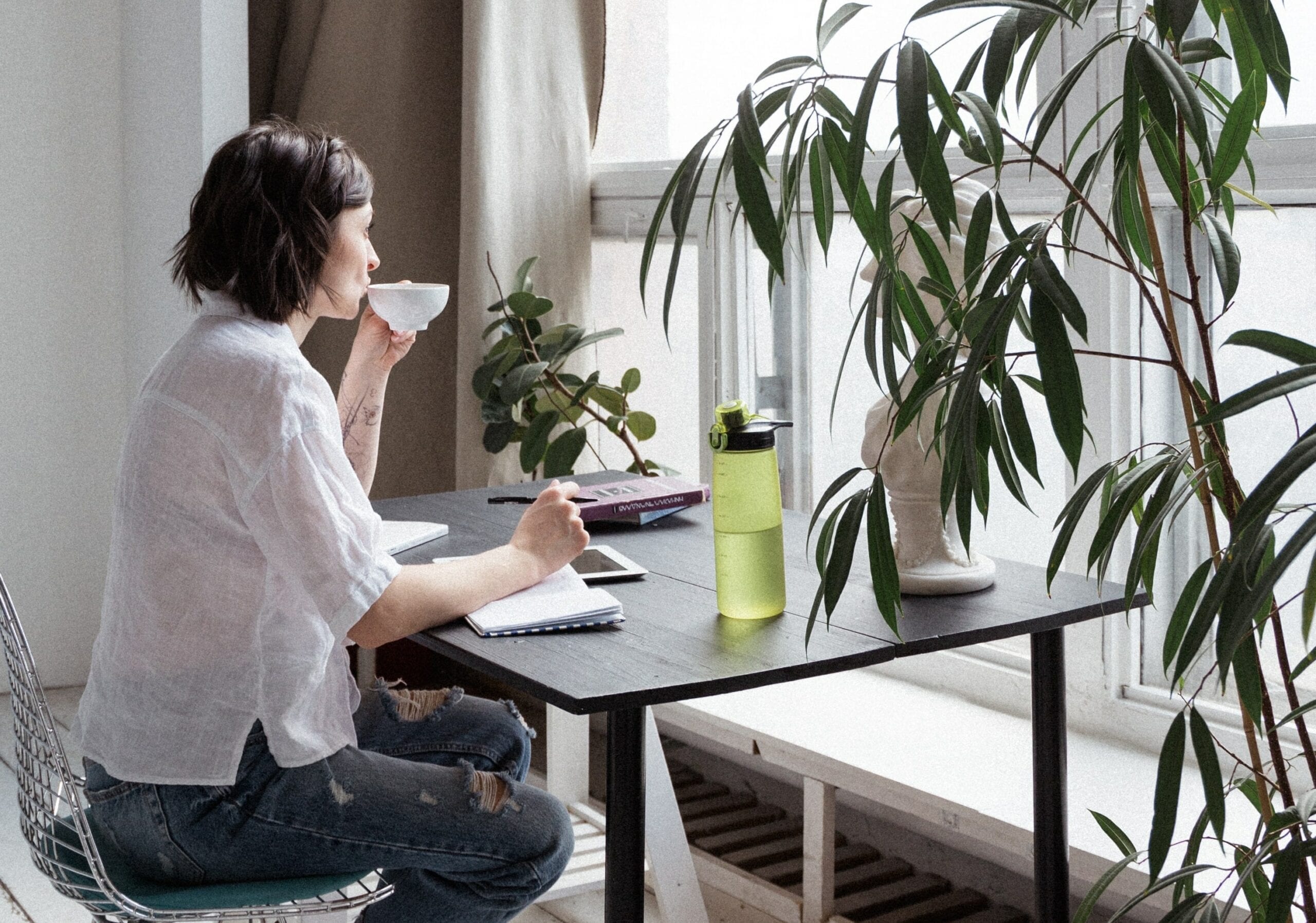 Woman looking out window pic