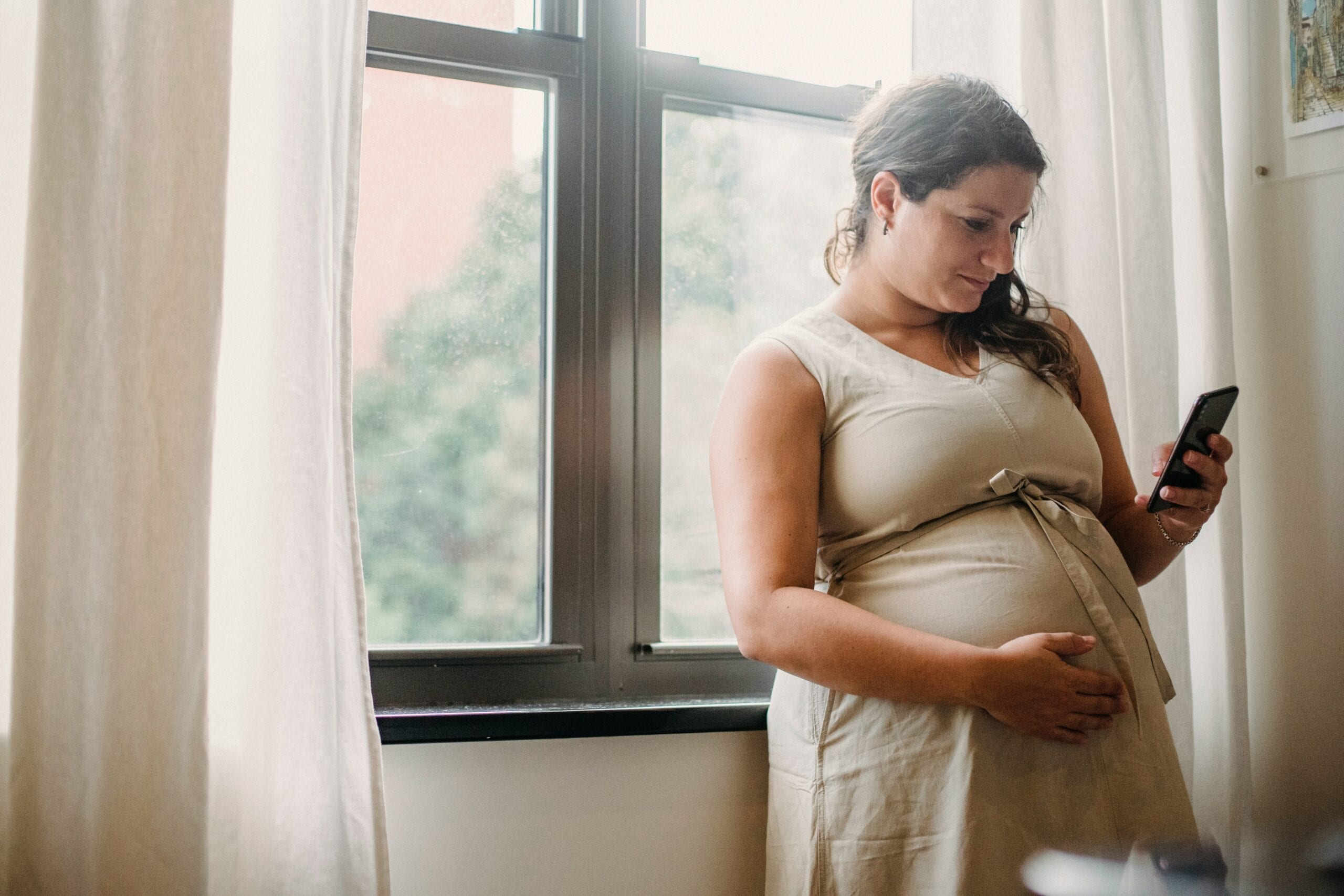 Pregnant woman on mobile phone