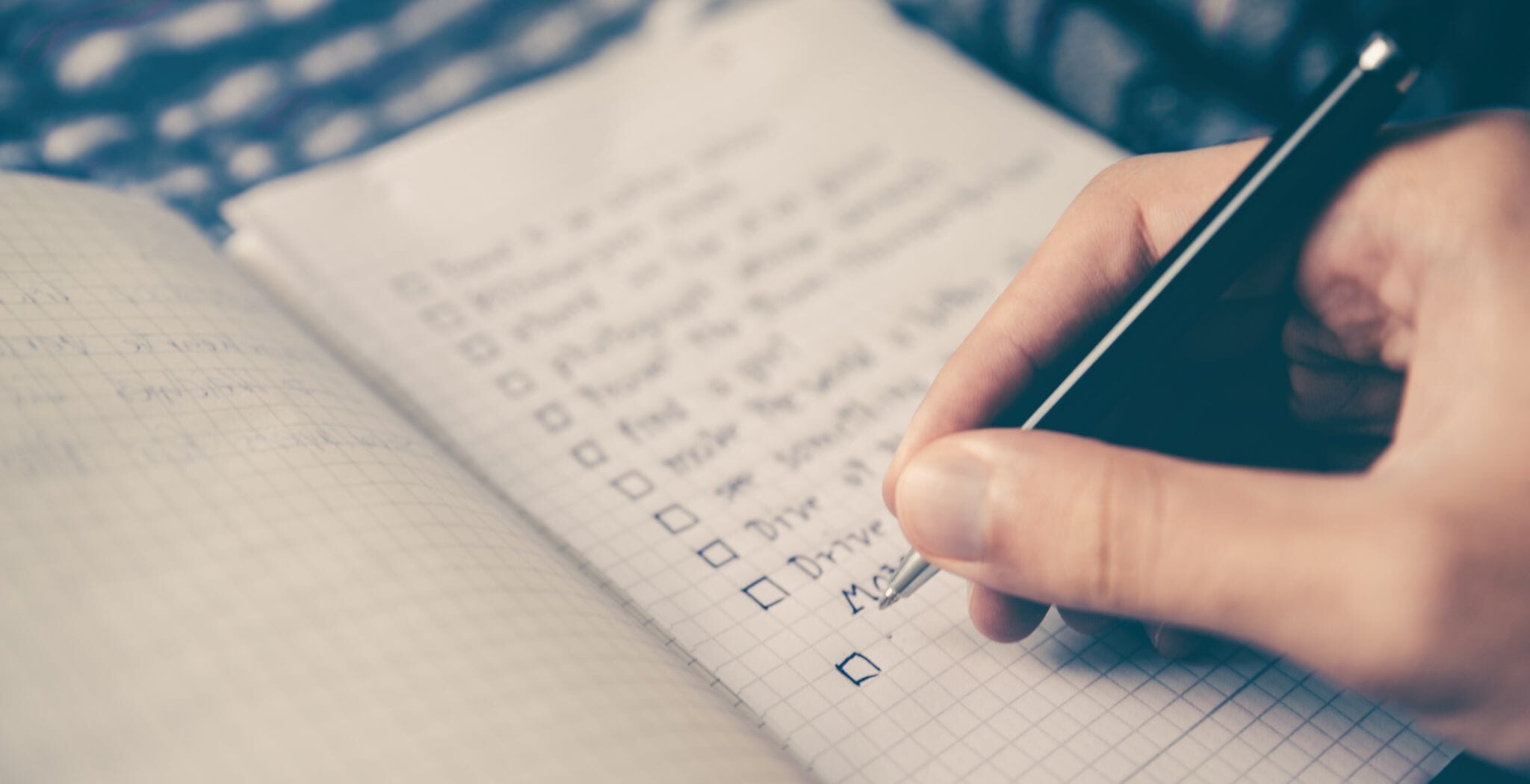 Person writing in a notebook